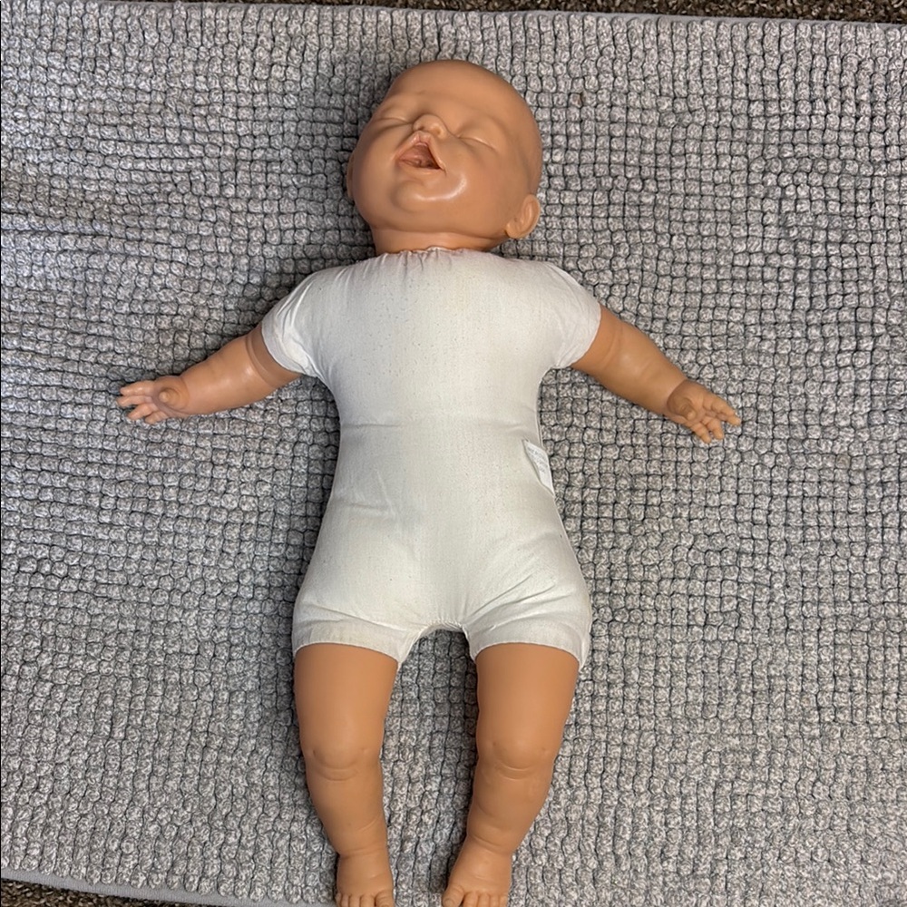 Realistic Baby Doll with White Outfit